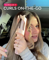 TYMO CURLGO held in hand to show portable size and travel-friendly convenience