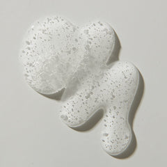 UNITE BLOW&SET held in hand to show 8 fl oz size and easy salon portability