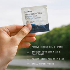 Ursa Major wipe in hand removing makeup for quick refresh
