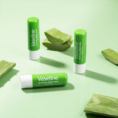 Vaseline stick held in hand to show compact travel-friendly scale