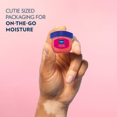 Vaseline mini jar inside a purse pocket for on-the-go hydration convenience