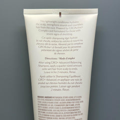 VEGAMOUR creamy conditioner texture swipe highlighting lightweight slip
