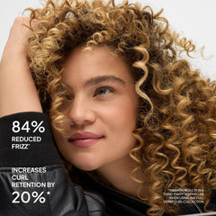 VERB creamy conditioner texture on fingers highlighting slip and moisture