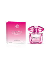 Versace Bright Crystal Absolu being sprayed on wrist demonstrating lasting fragrance and easy application