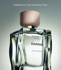 Victoria's Secret spray in hand demonstrating effortless application