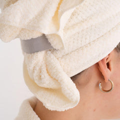VOLO towel being used to plop curls for defined, frizz-reduced styling benefit