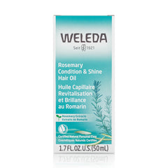 Weleda rosemary hair oil dispensing a drop from the bottle to illustrate easy, measured application