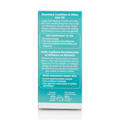 Hand holding Weleda rosemary hair oil bottle to demonstrate compact 1.7 fl oz travel-friendly size