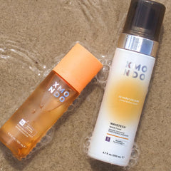 XMONDO applying foam to damp hair while scrunching to boost waves