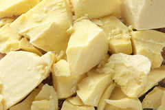 Yellow Brick Rd raw cocoa butter block front packaging showing weight and unrefined quality