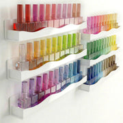 YMVV front view of six white acrylic racks showing neat polish display benefit