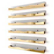 YMVV front view of gold mirror shelf showing organized bottles and elegant display benefit