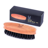 ZEUS pocket brush front view showing compact profile and firm control