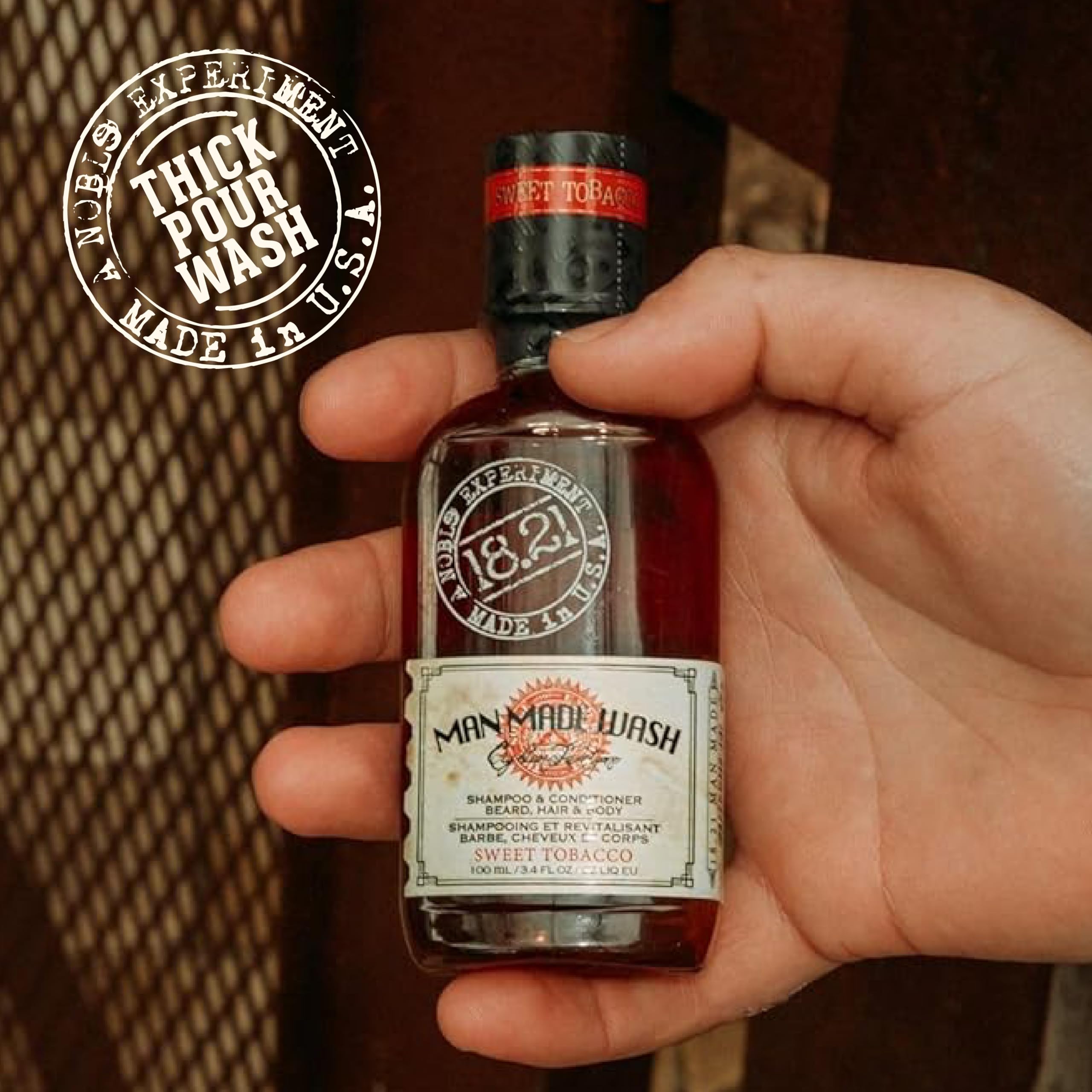 18.21 Man Made Sweet Tobacco bottle on bathroom shelf evoking vintage luxury