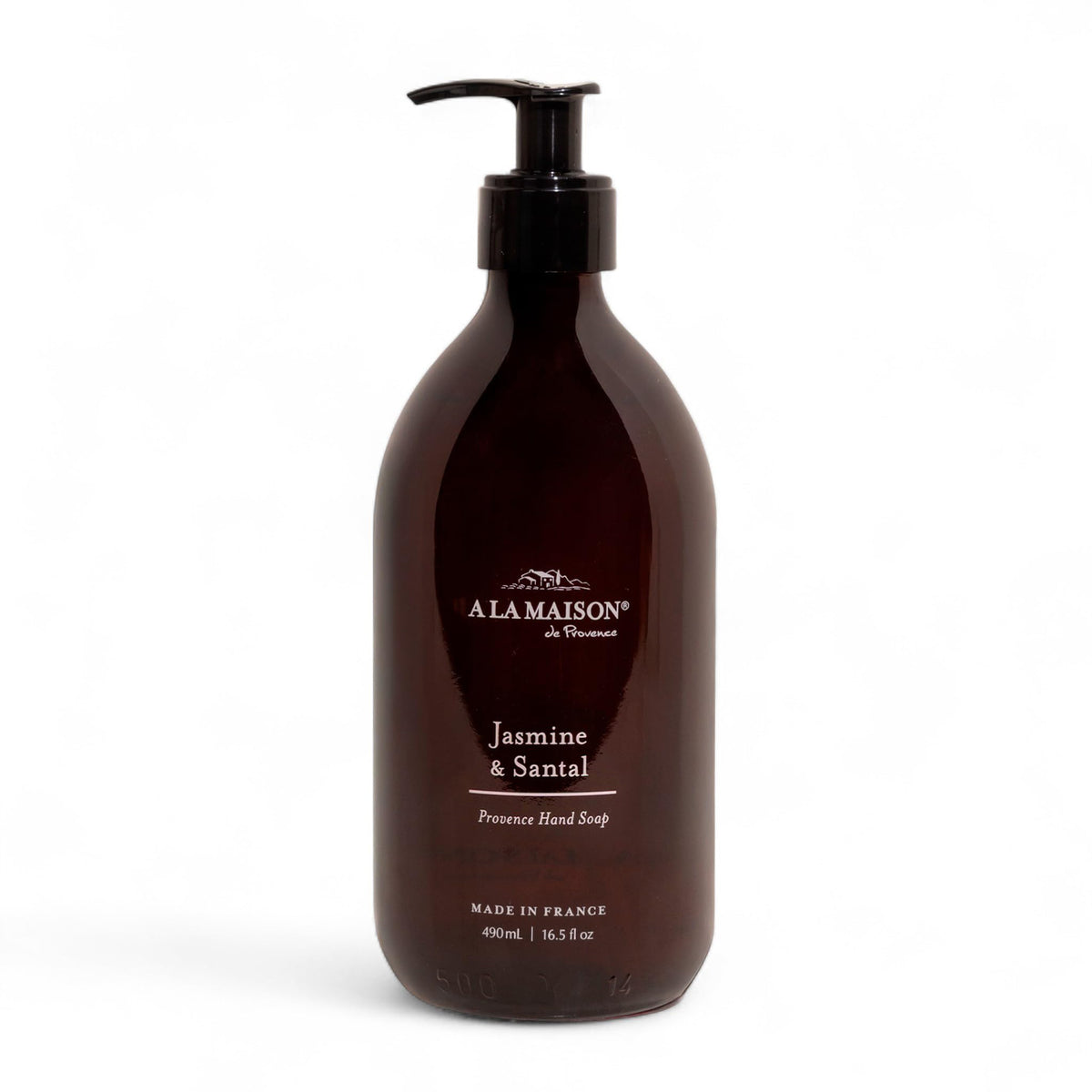 A LA MAISON amber glass bottle front view showing elegant packaging and refill benefit
