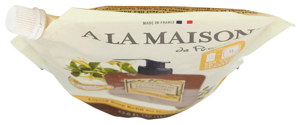 A LA MAISON honeysuckle pouch next to hand showing true size and economy