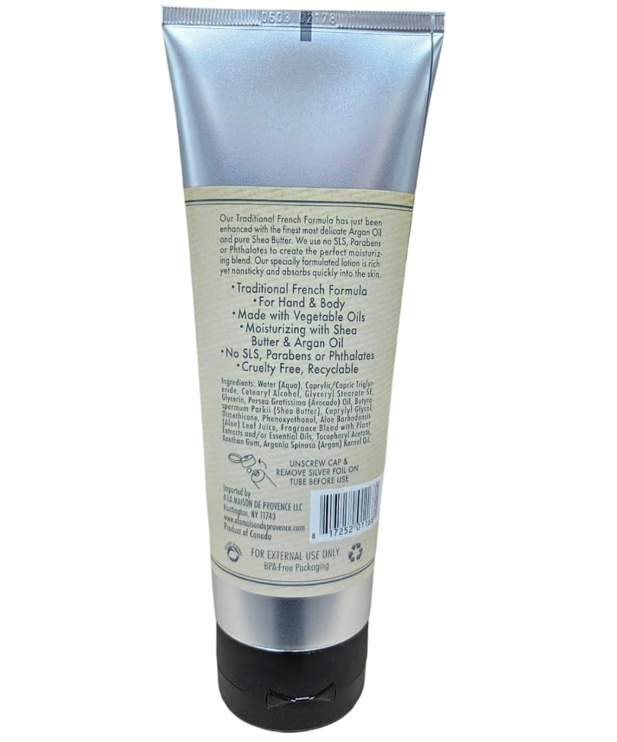 A LA MAISON bottle on beach towel evoking Fresh Sea Salt scent for refreshing uplift