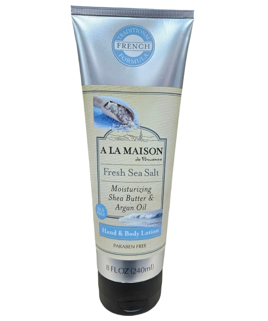 A LA MAISON lotion spread on forearm showing moisturizing coverage and non-greasy finish