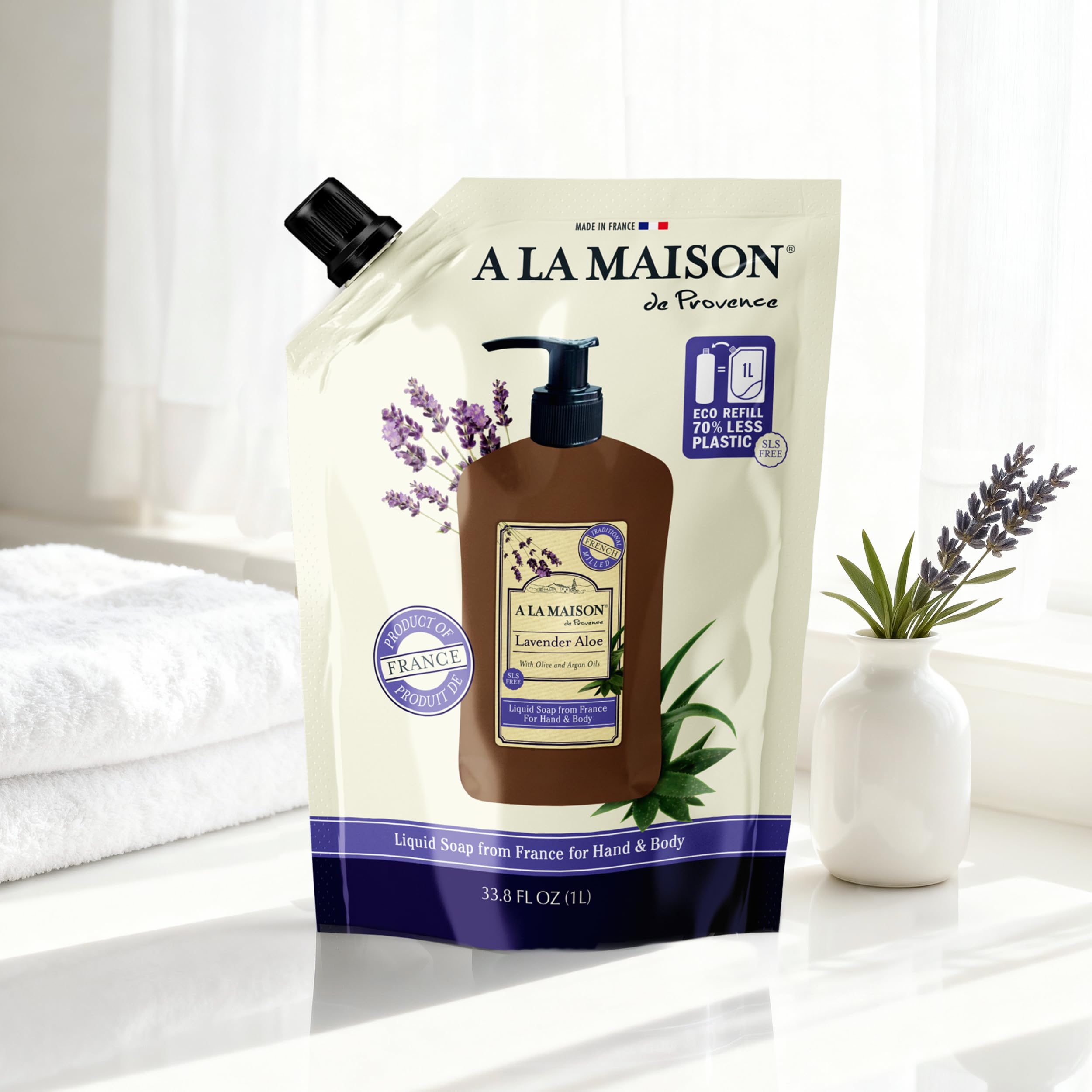 A LA MAISON pouch being poured into dispenser for easy refills
