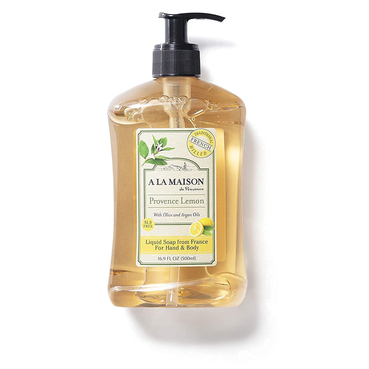 A LA MAISON bottle beside sink in kitchen setting conveying fresh citrus clean