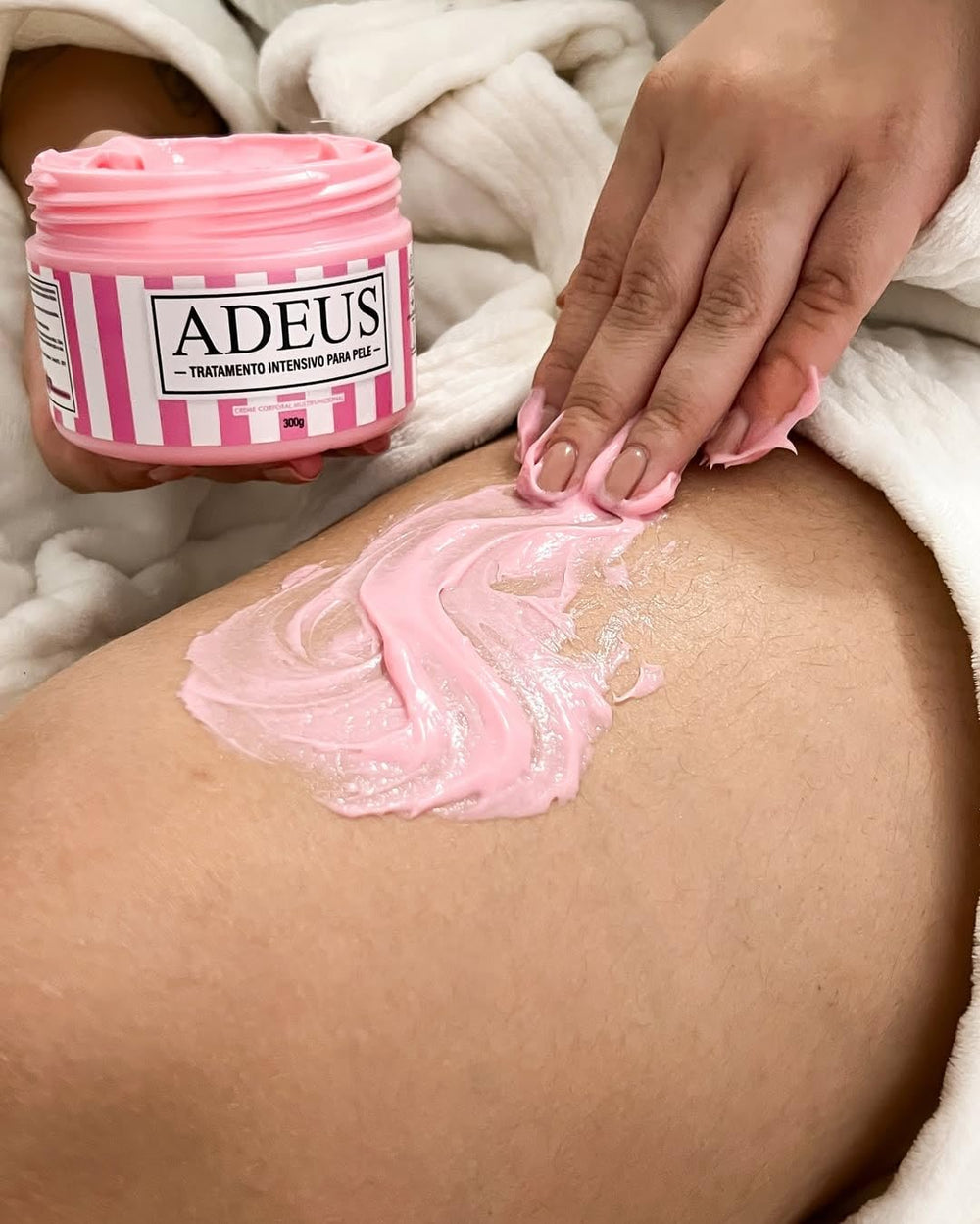 ADEUS cream texture on spoon close-up highlighting smooth, fast-absorbing formula