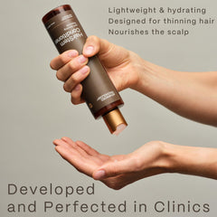 Advanced Trichology bottle next to towel in bathroom showing daily use