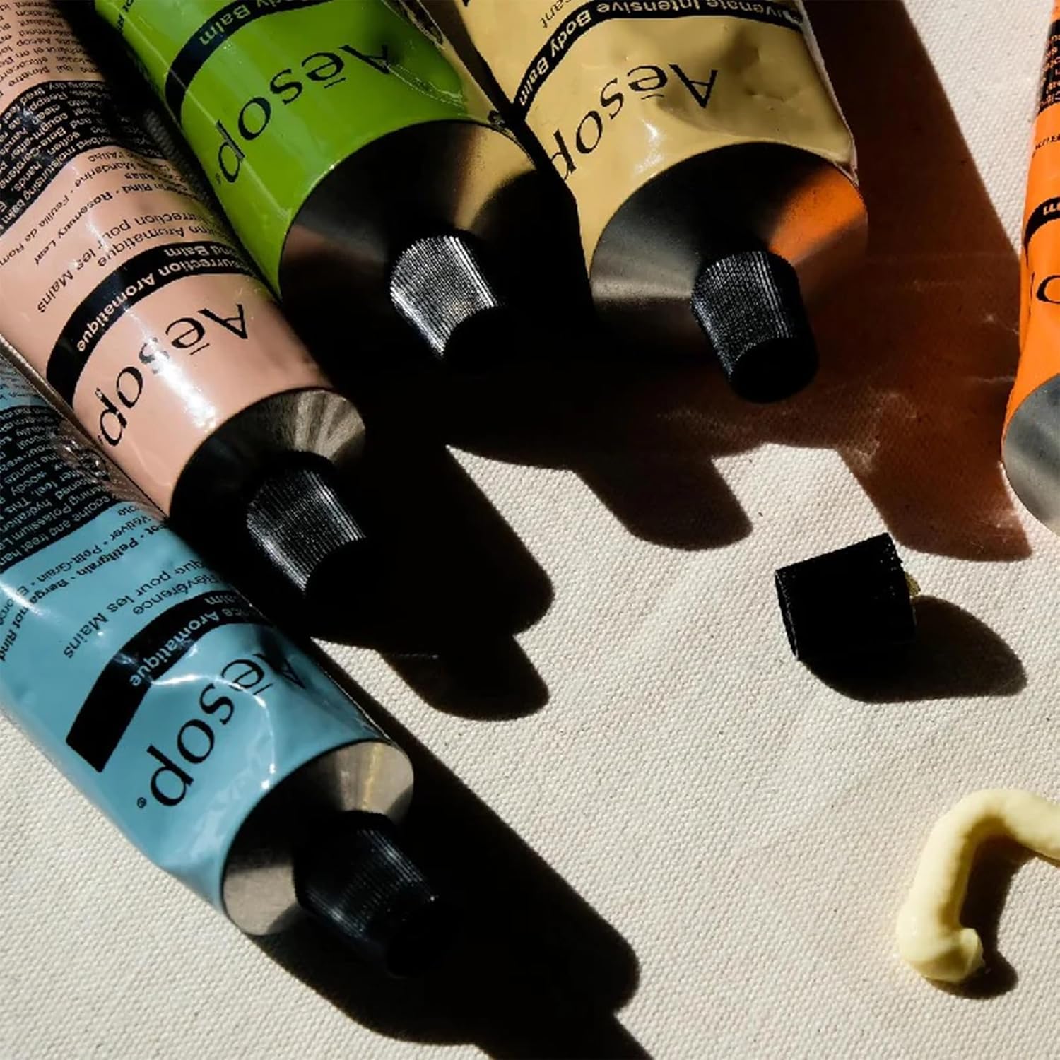 Aesop recycled tube detail emphasizing 100% recycled aluminum packaging