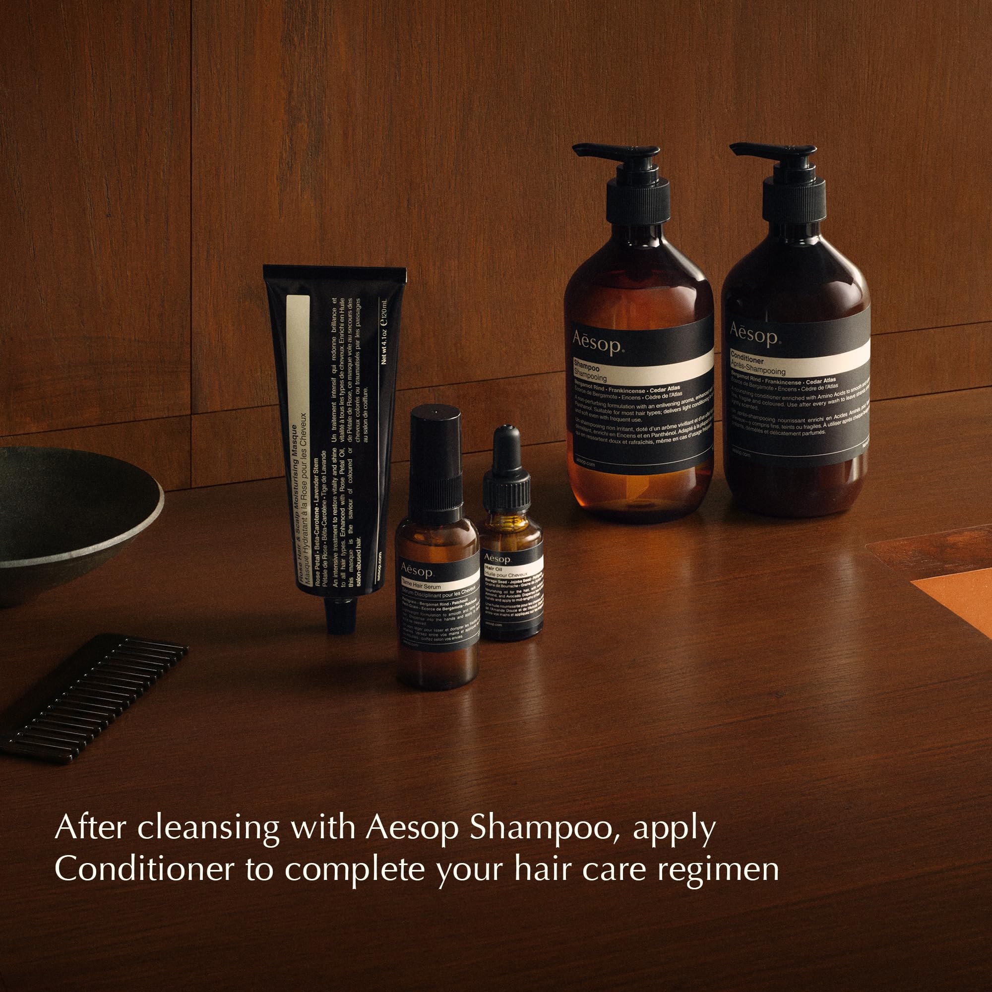 Aesop volumizing shampoo 500mL bottle next to ruler showing true scale