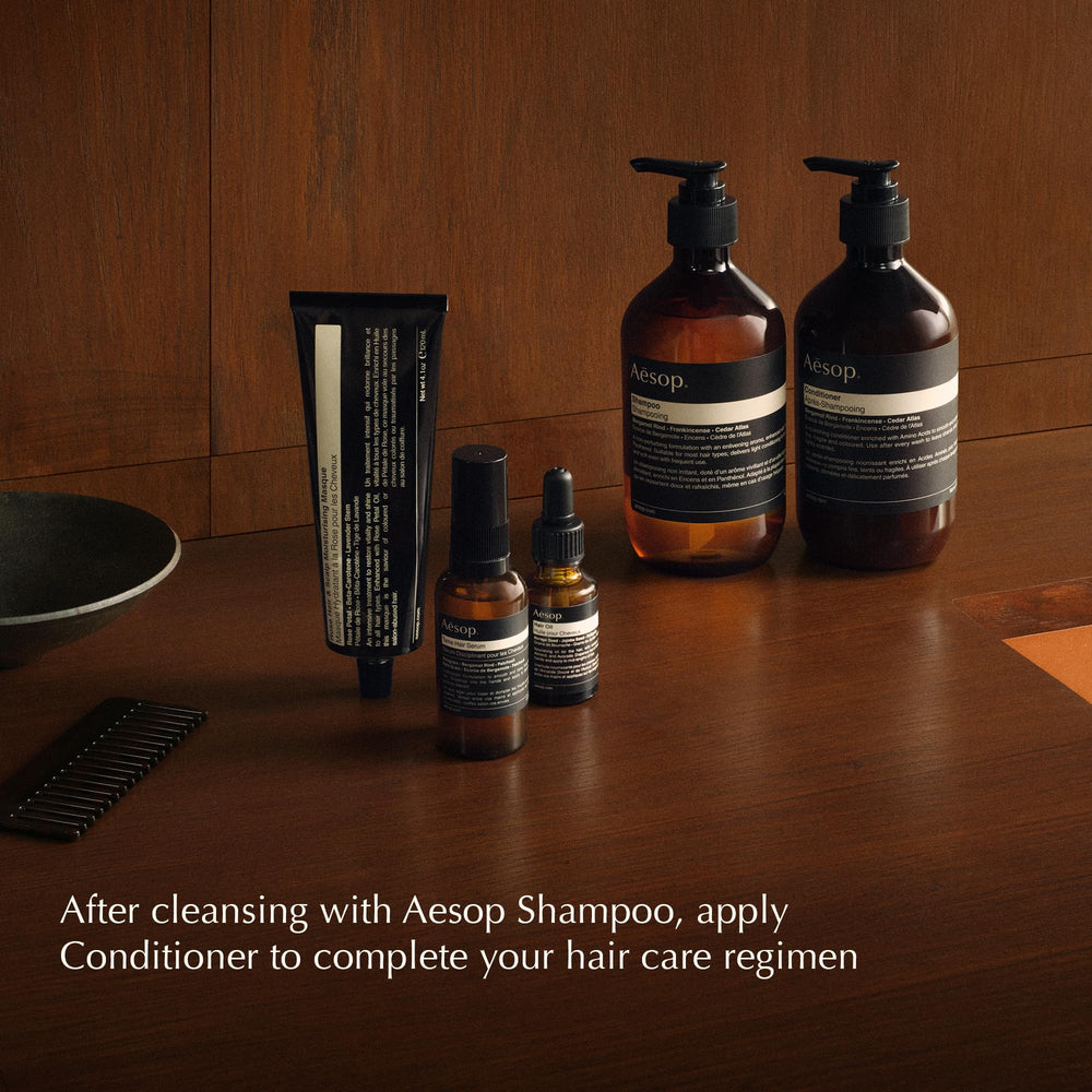 Aesop volumizing shampoo 500mL bottle next to ruler showing true scale