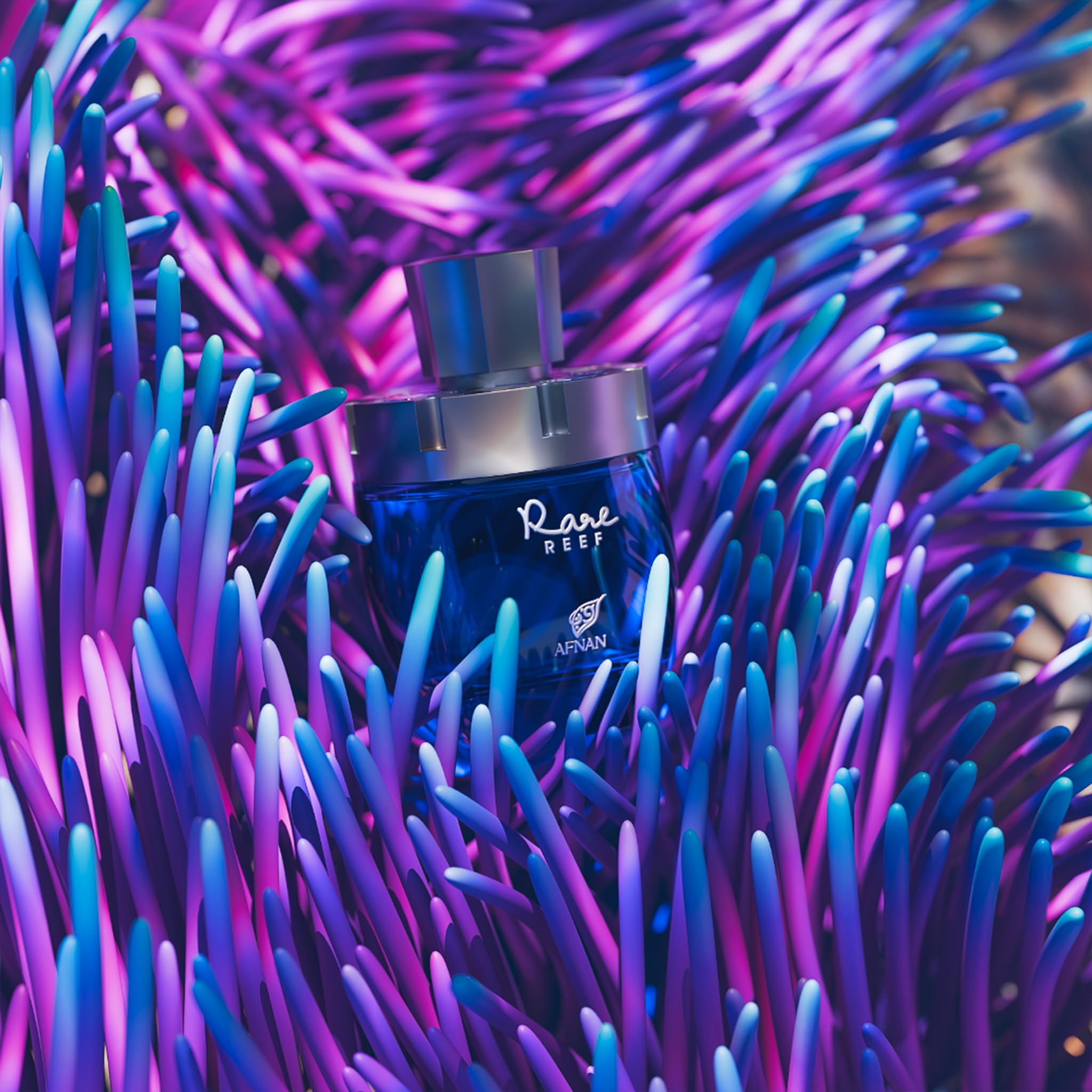 Afnan Rare Reef bottle on beach scene suggesting coastal freshness