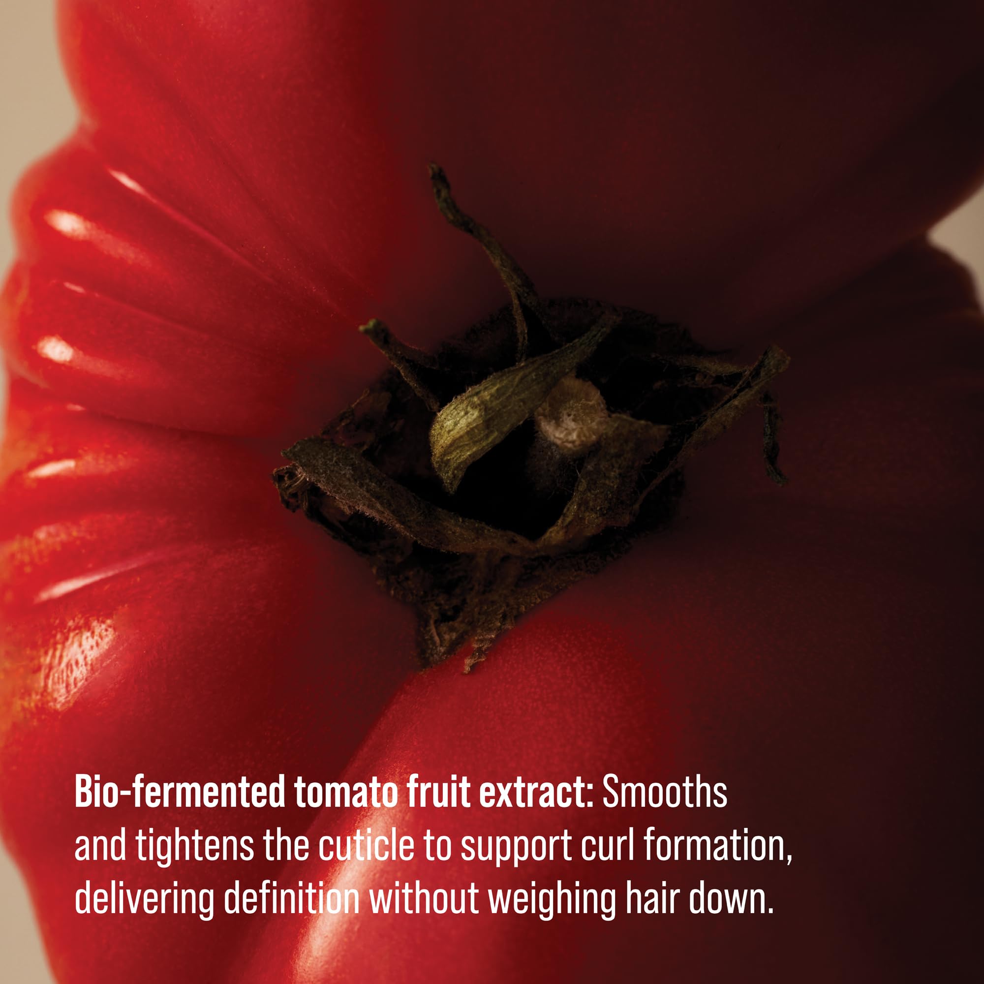 AG Care application in hand smoothing product through damp curls for control