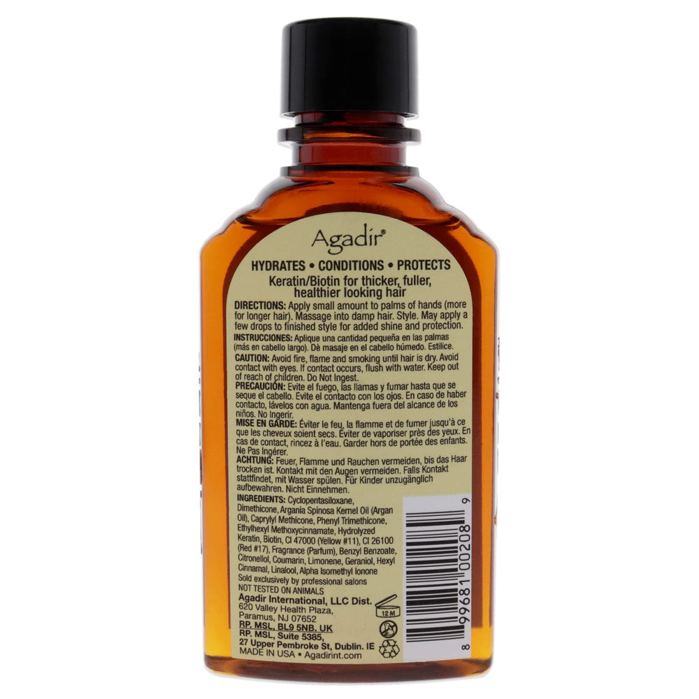 Agadir argan oil texture pouring from bottle, demonstrates lightweight absorption