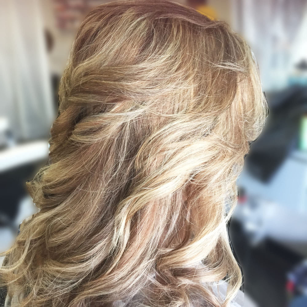 Agadir styled blowout in lifestyle shot displaying long-lasting volume and shine