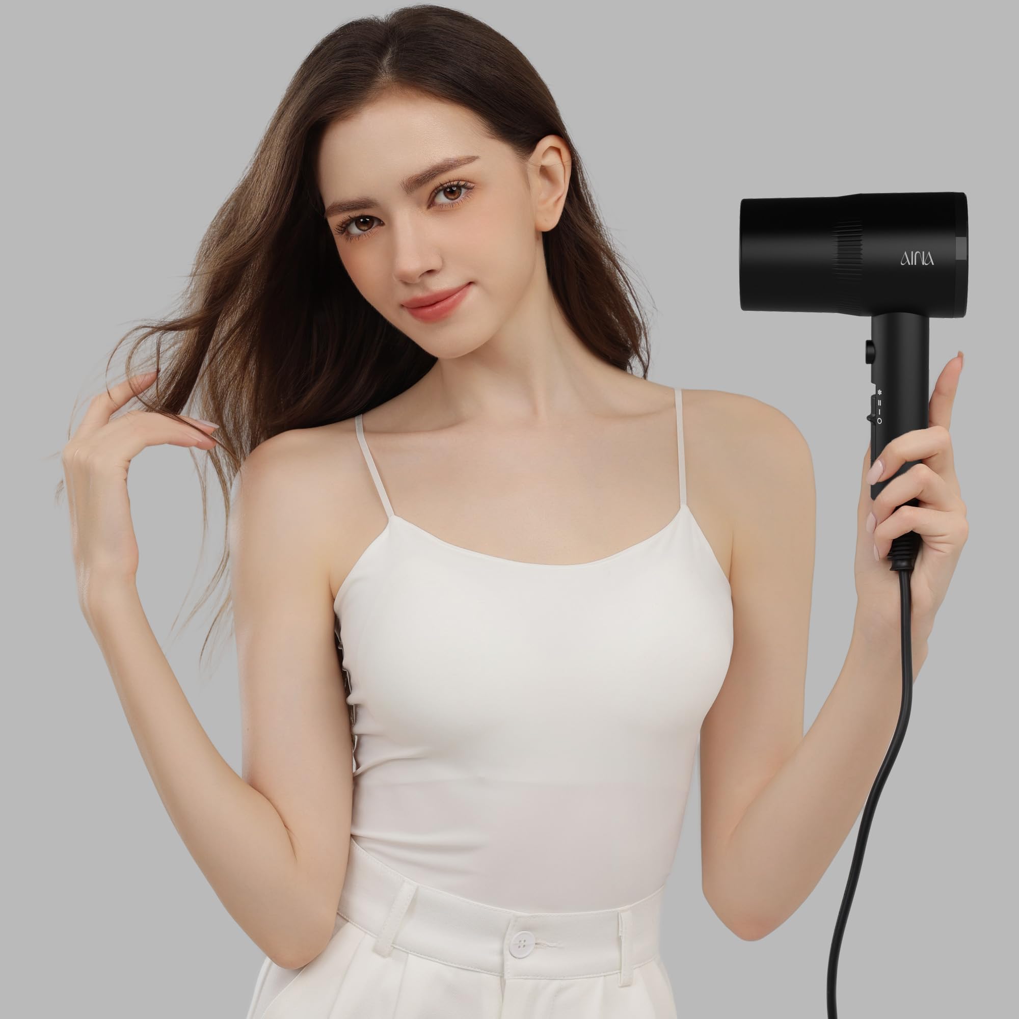 AINA in use on curly hair showing faster dry time and frizz reduction benefit