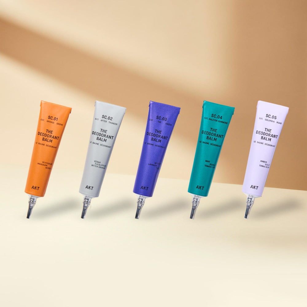 AKT five mini deodorant balms arranged to display variety and portability