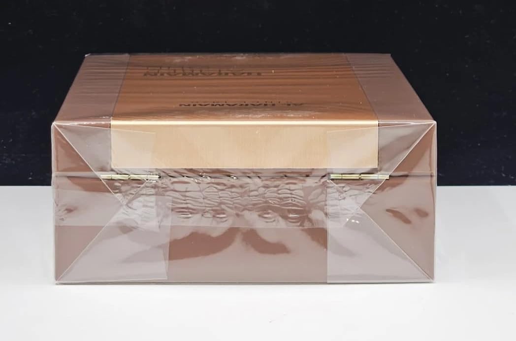 Al Haramain bottle next to a ruler showing 3.33 oz size and travel practicality