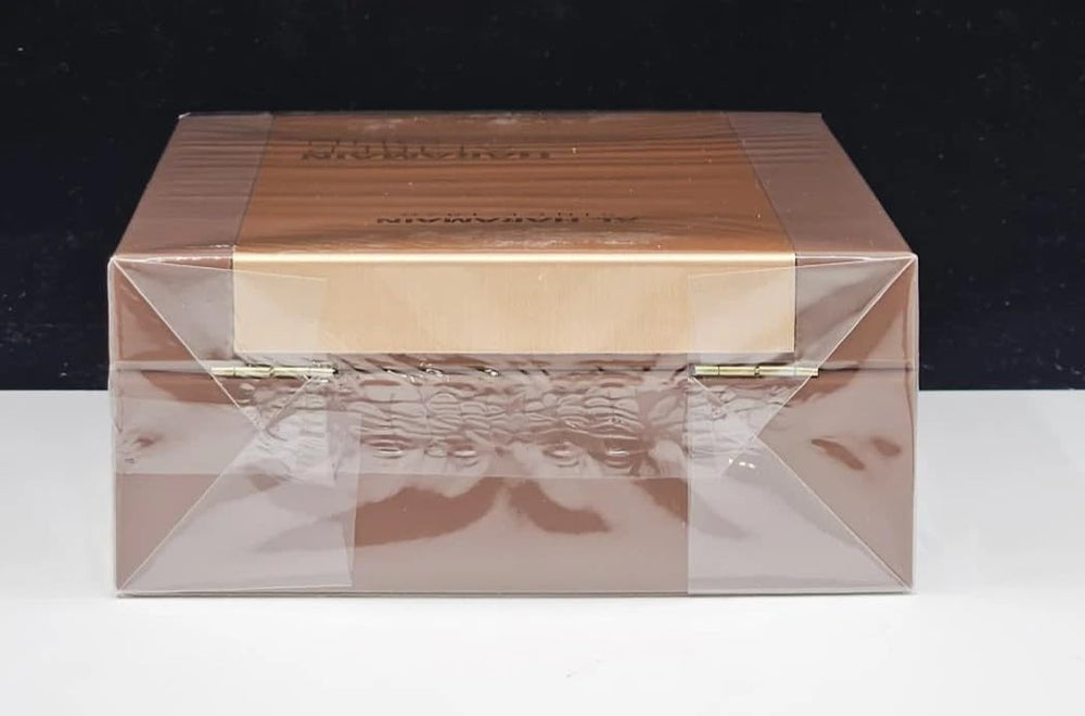 Al Haramain bottle next to a ruler showing 3.33 oz size and travel practicality