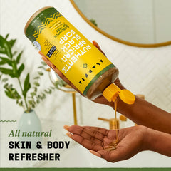 Alaffia travel 2 oz bottle beside 32 oz for portable convenience