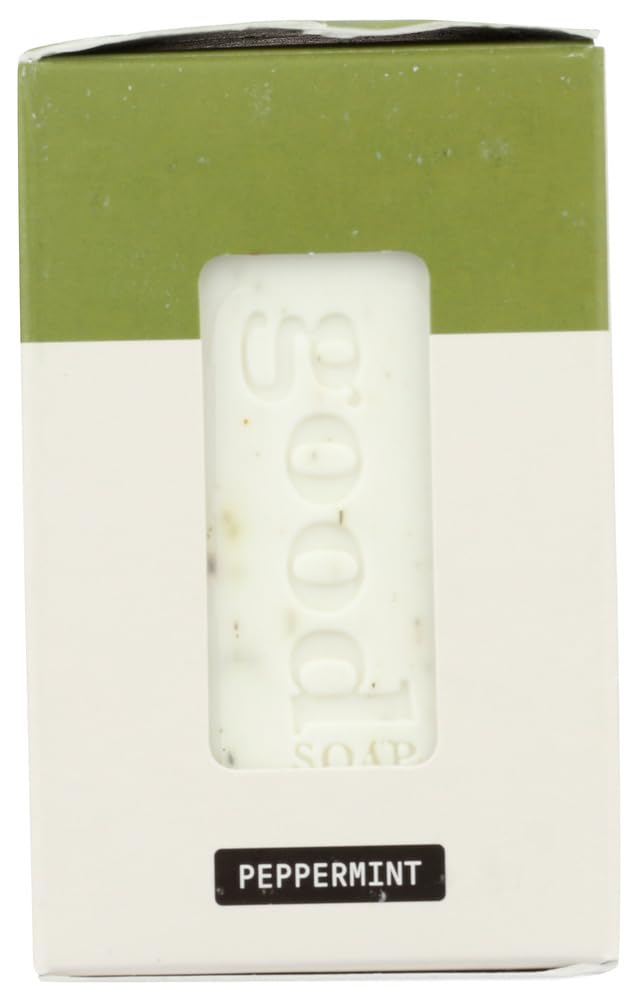 Alaffia stacked bars beside a ruler for scale, indicating travel-friendly size