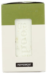 Alaffia stacked bars beside a ruler for scale, indicating travel-friendly size