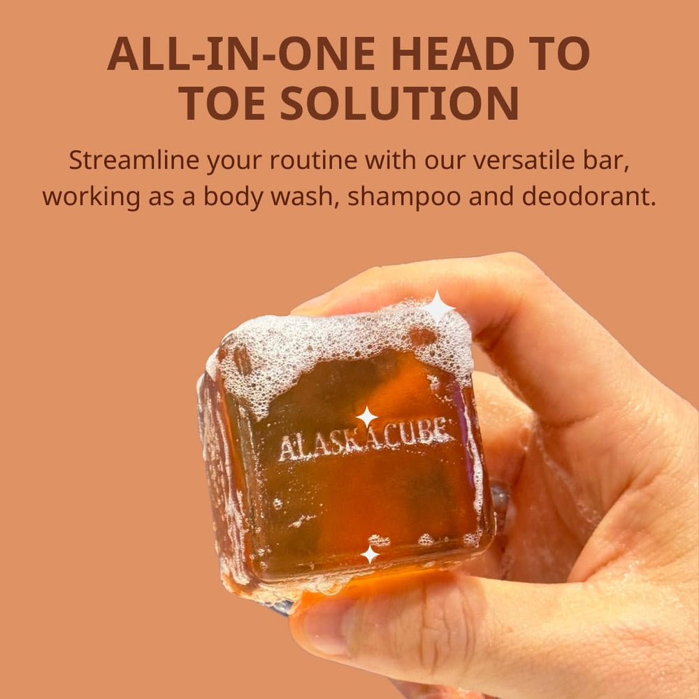 Alaskacube bar in a hand for scale, highlights compact travel-friendly size