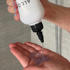 Alcôve 10.1 oz bottle in hand showing travel-friendly size and convenience