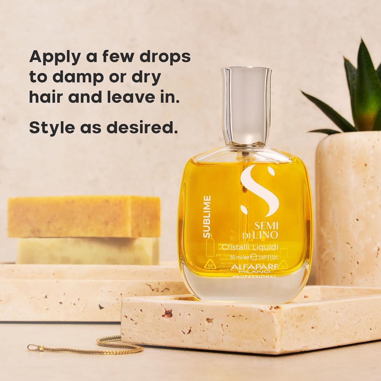 ALFAPARF MILANO oil drops on a hair strand adding instant gloss and smoothness