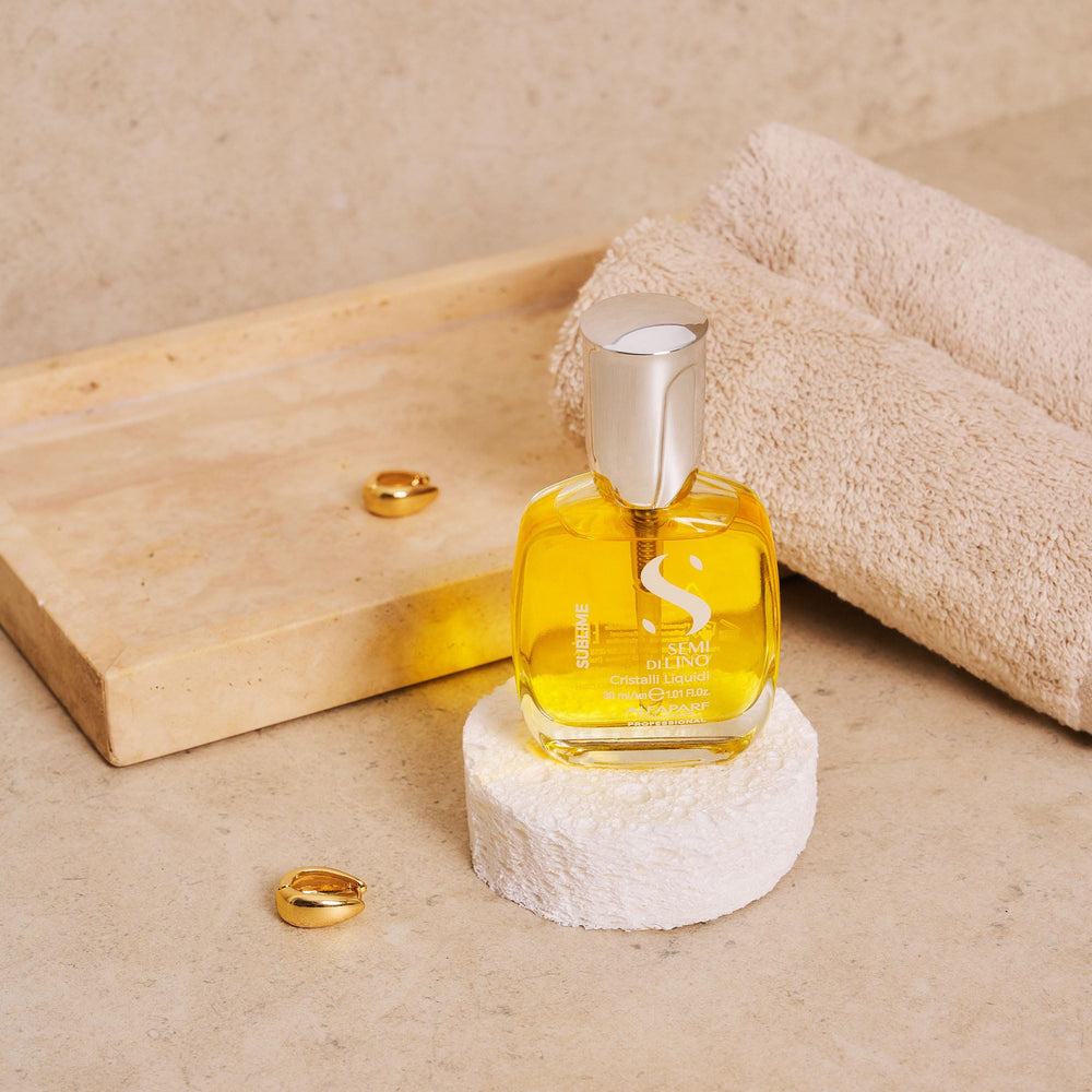 ALFAPARF MILANO bottle styled on bathroom shelf conveying daily routine convenience