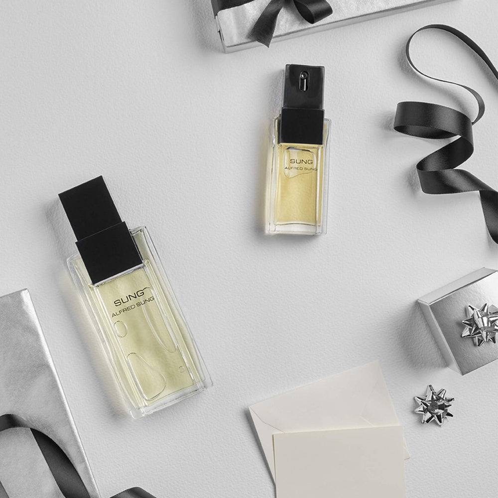 ALFRED SUNG composition of citrus and white flowers conveying fresh natural ingredients