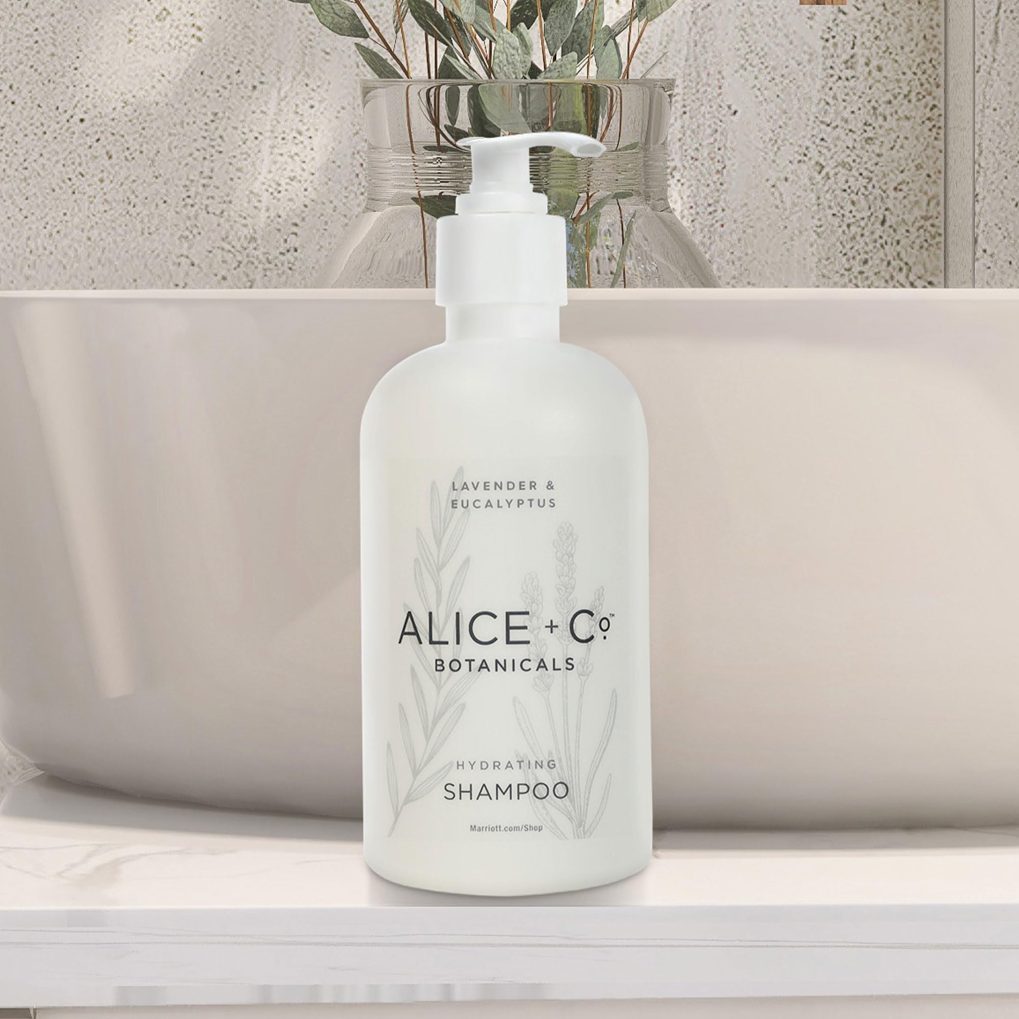 Alice + Co. hands dispensing shampoo, illustrating easy use and controlled application
