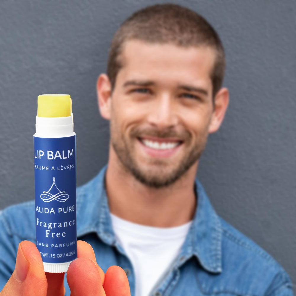 ALIDA PURE tube held in hand to show size and portability for daily use