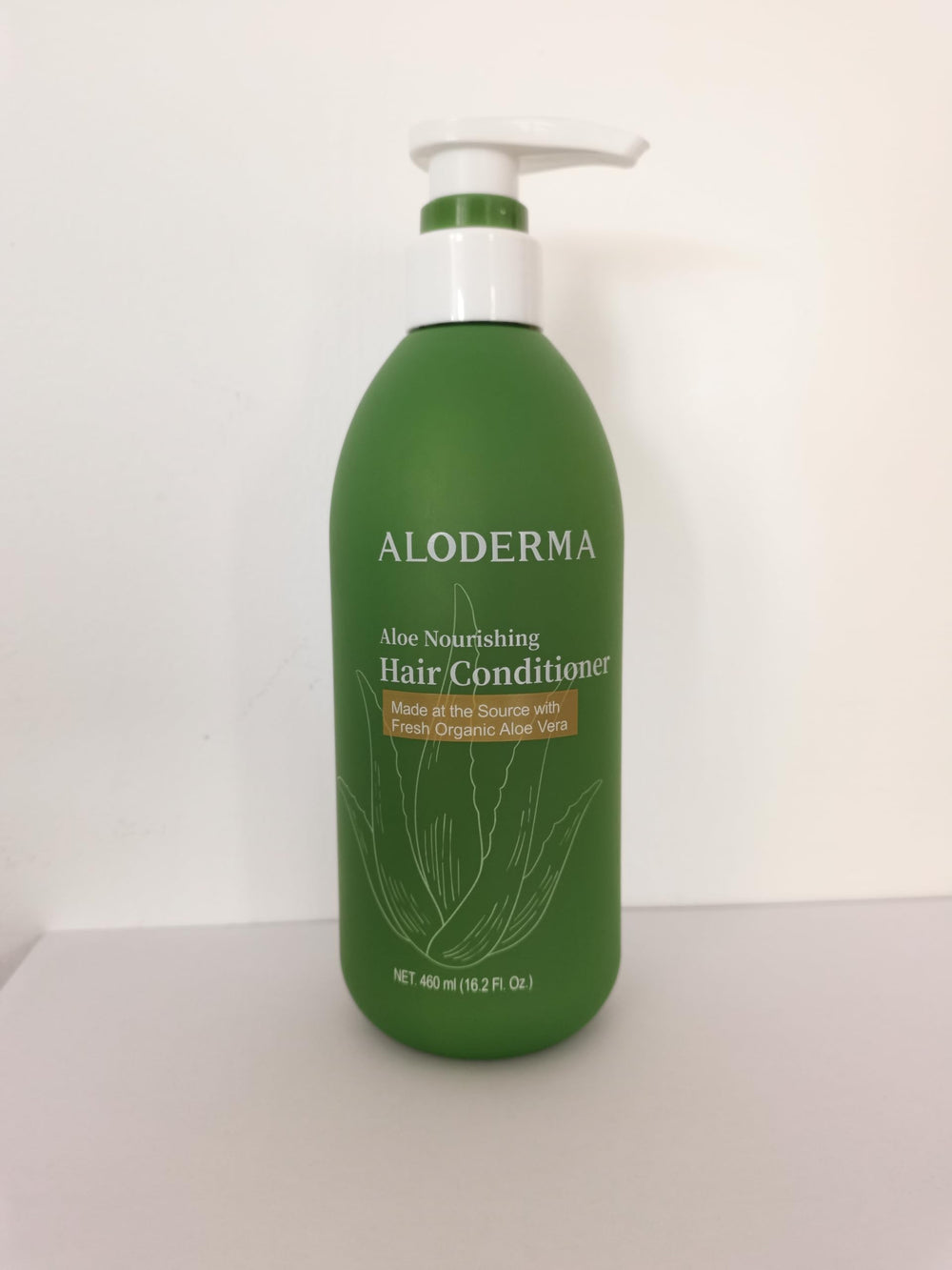 Aloderma conditioner being poured to show silky, lightweight formula