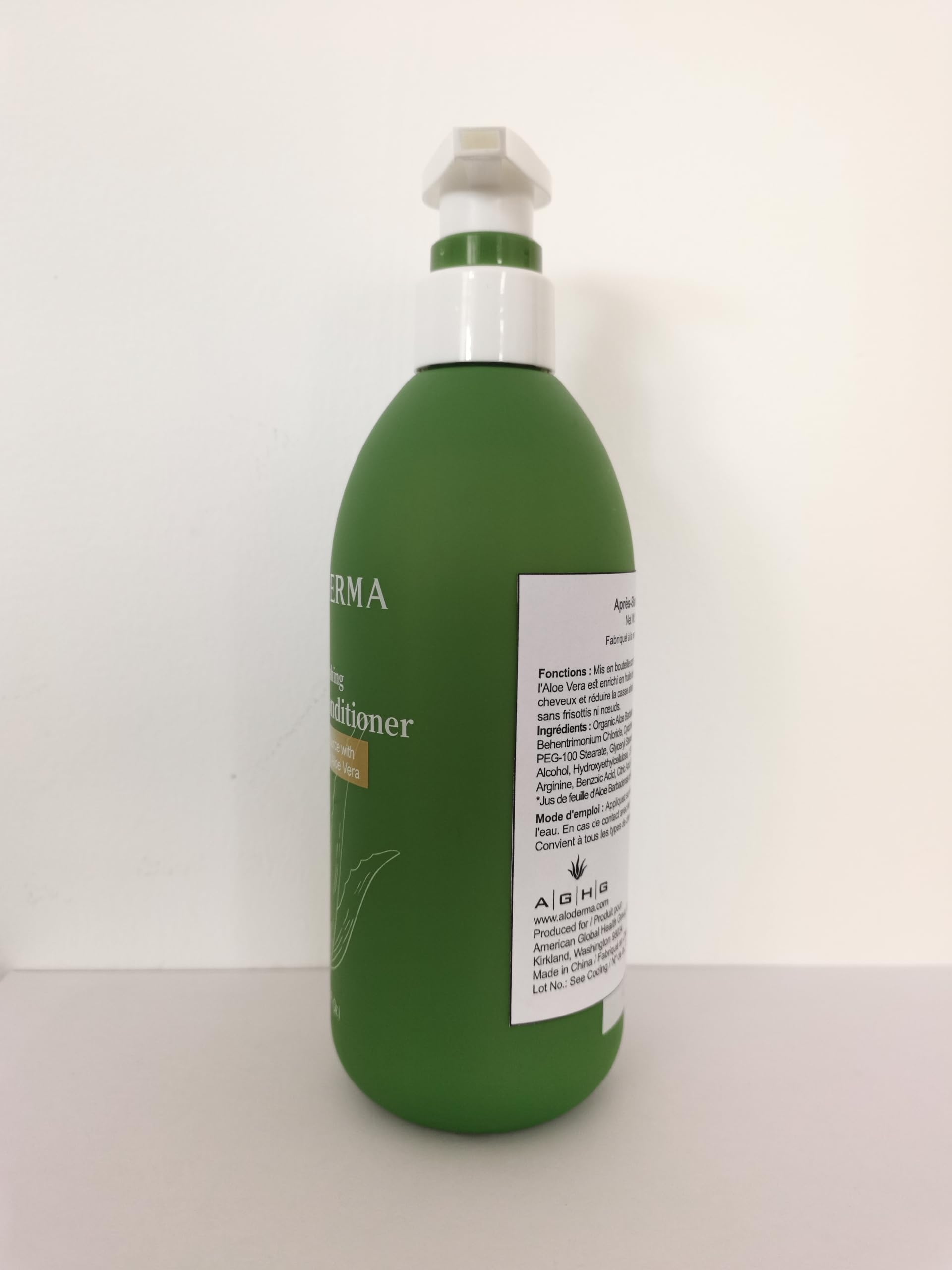 Aloderma bottle held in hand demonstrating 16.2 oz size and scale