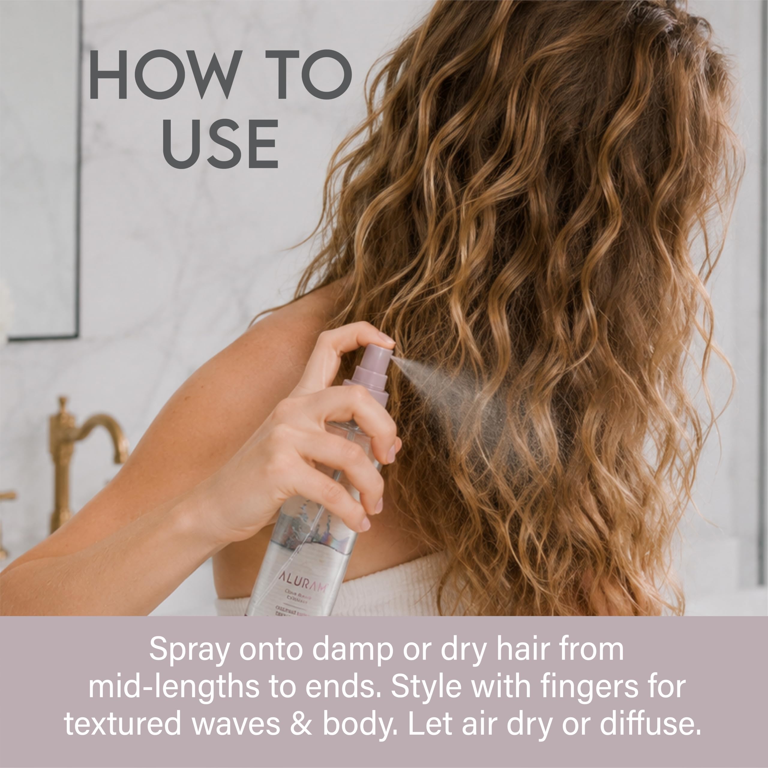 Aluram being sprayed on dry hair to add instant lift and touchable grit